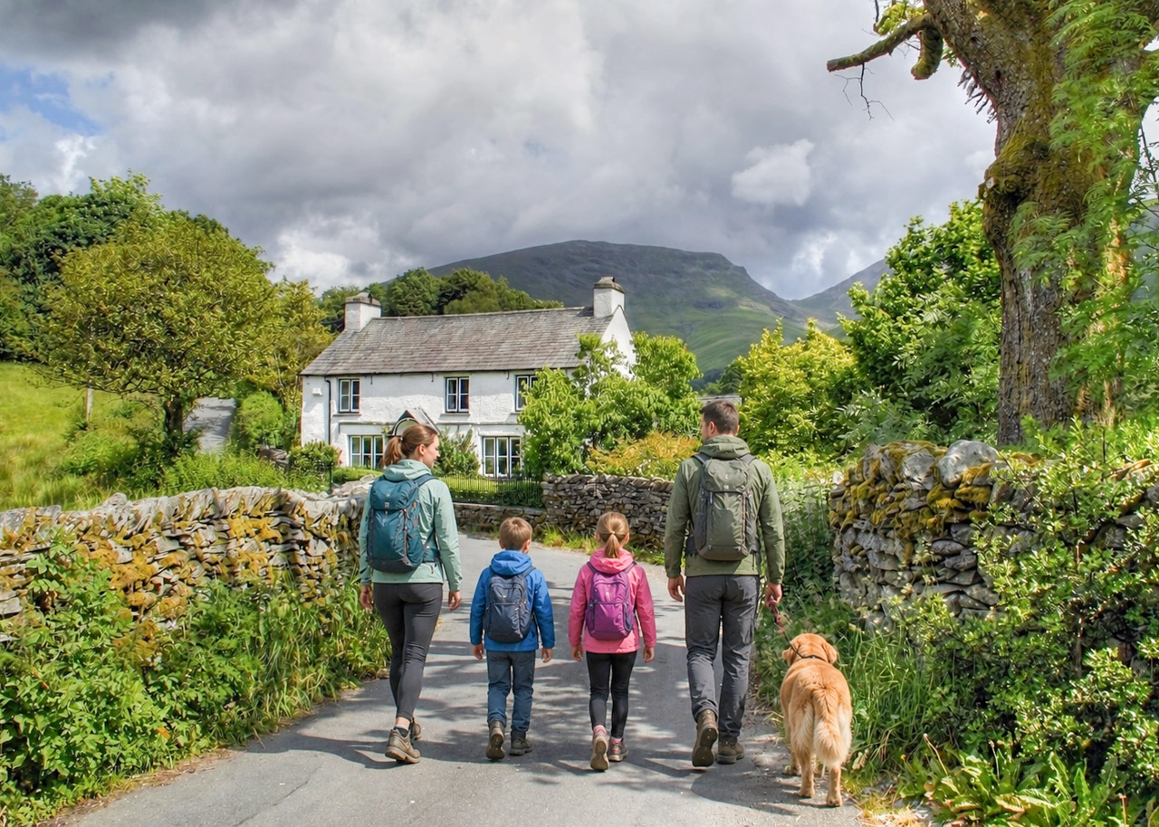 family walking to a cottage in Grasmere